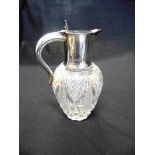 A LATE VICTORIAN SILVER MOUNTED GLASS CLARET JUG by Williams Hutton & Sons Ltd, London 1896, the