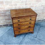 A SMALL MAHOGANY CHEST OF FOUR LONG GRADUATED DRAWERS beneath brushing slide, 62cm wide 46cm deep