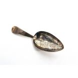 A GEORGE III SILVER CADDY SPOON possibly George Burrows I, London 1798, the oval bowl engraved as