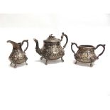 A VICTORIAN SILVER THREE PIECE BACHELOR TEA SERVICE by Robert Harper, London 1866, of baluster form,