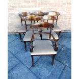 A SET OF SIX LATE REGENCY MAHOGANY DINING CHAIRS including a carver, with carved back rails,