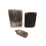 A SILVER EDWARDIAN COMBINATION SOVEREIGN AND VESTA CASE a silver cigarette case and leather purse