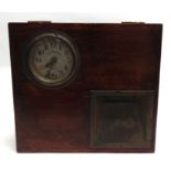 A BLICK TIME RECORDER CLOCK with a stained wood case, 31cm x 35.5cm.