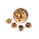 A COLLECTION OF MINATURE PORCELAIN TEAWARE with painted fruit decoration signed 'Bryan Cox' and a