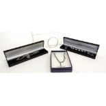 A DOMINIC WALMSLEY SILVER BRACELET 2002, with original box; a Dominic Walmsley silver bangle,