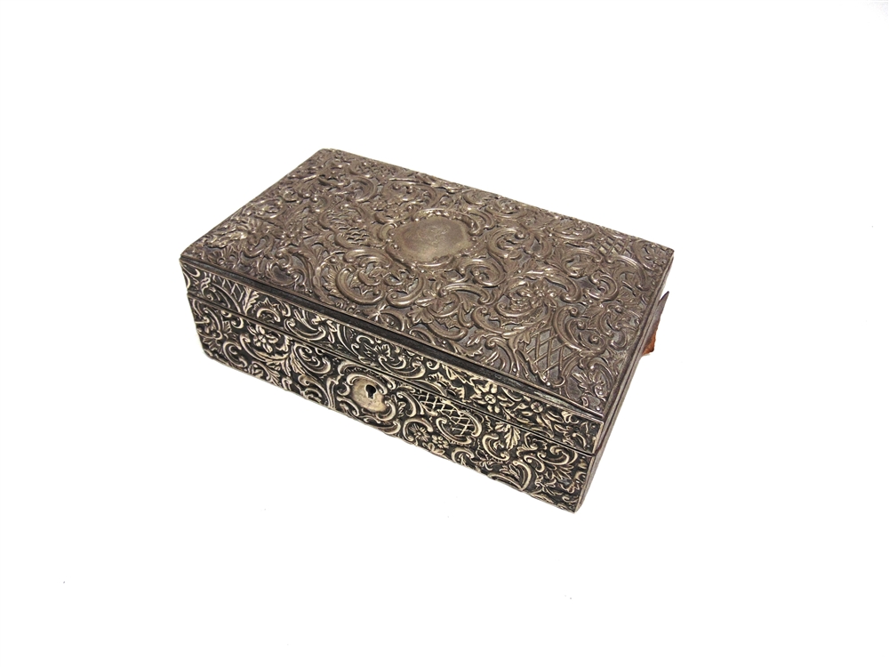 A SILVER CLAD LEATHER BOUND WOODEN BOX by H. Matthews, Birmingham 1896, the lid and front applied