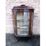 AN EDWARDIAN MAHOGANY DEMI-LUNE DISPLAY CABINET on claw and ball supports, 98cm wide 41cm deep 158cm