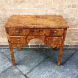 A BURR YEW VENEERED LOWBOY fitted with three drawers, on chamfered square supports, 90cm wide 50cm
