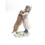 A LLADRO FIGURAL GROUP 'A WARM WELCOME/ CARINOSA BIENVENIDA' no. 6903, modelled as a young girl