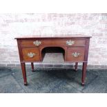 A 19TH CENTURY MAHOGANY LOWBOY with long drawer above kneehole flanked by two further drawers, on