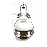AN EDWARDIAN HANGING OIL LAMP with brass reservoir, the opaque glass shade 36cm diameter, the