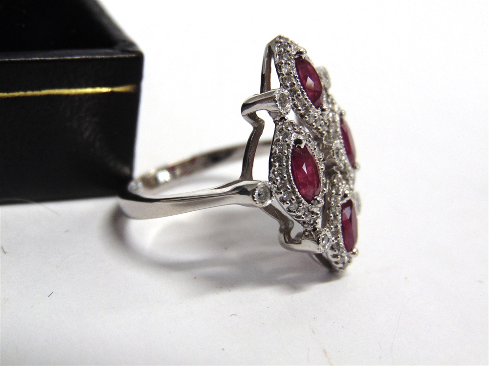 AN 18CT WHITE GOLD DRESS RING set with four oval rubies approximately 1.34ct in total and round - Image 5 of 6