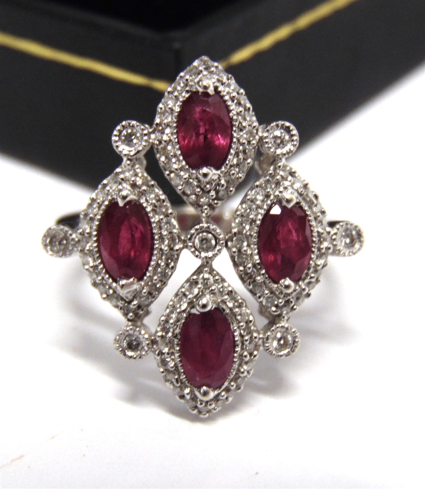 AN 18CT WHITE GOLD DRESS RING set with four oval rubies approximately 1.34ct in total and round - Image 3 of 6