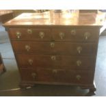 AN EARLY 18TH CENTURY WALNUT CHEST OF TWO SHORT AND TWO LONG DRAWERS with featherbanded inlay, on