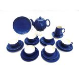 A MOORCROFT POWDER BLUE TEA SERVICE comprising six tea cups, saucers and side plates, milk jug,