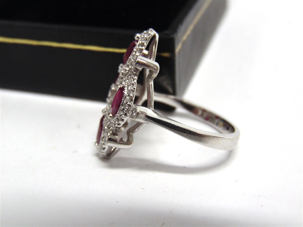 AN 18CT WHITE GOLD DRESS RING set with four oval rubies approximately 1.34ct in total and round - Image 6 of 6