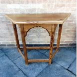 A PITCH PINE CREEDENCE TABLE on chamfered supports, 130cm wide 50cm deep 89cm high