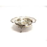 A SILVER FRUIT BOWL by Cooper Brothers & Sons Ltd, Sheffield 1924, the bowl with scroll and shell
