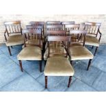 A SET OF TWELVE GEORGE IV MAHOGANY DINING CHAIRS including a pair of carvers, with tablet centred