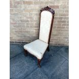 A VICTORIAN CARVED ROSEWOOD FRAMED NURSING CHAIR with high back, on cabriole supports, 49cm wide