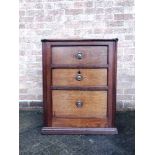 A 19TH CENTURY MAHOGANY CABINET with hinged top opening to compartment beneath, one faux and two