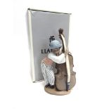 A LLADRO FIGURE 'JAZZ BASS/ CONTRABAJO JAZZ' no. 5834, modelled as a boy playing double bass, 25cm