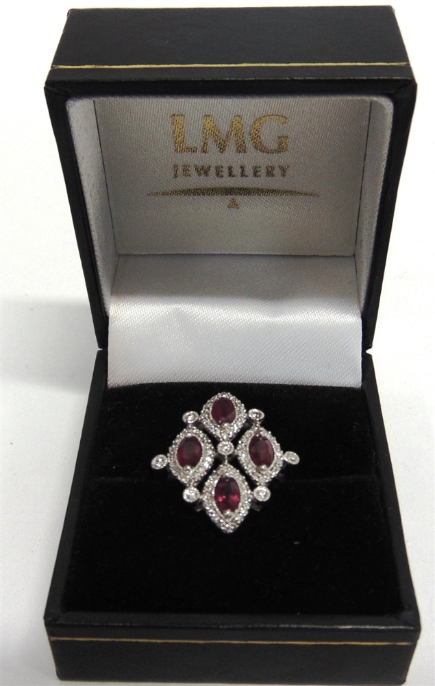 AN 18CT WHITE GOLD DRESS RING set with four oval rubies approximately 1.34ct in total and round - Image 4 of 6