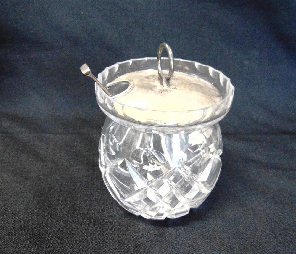 A GLASS PRESERVE POT with silver cover and spoon