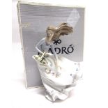 A LLADRO FIGURE 'PETALS ON THE WIND/ AROMAS EN LA VIENTO' no. 6767, modelled as a young girl