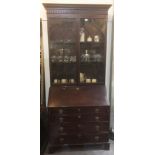 A GEORGE III MAHOGANY BUREAU BOOKCASE with dentil frieze above astragal glazed door, the bureau base