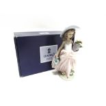 A LLADRO FIGURE 'A WISH COME TRUE/ QUE BONITAS' NO. 7676 modelled as a young girl with watering