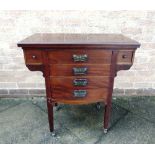 AN EDWARDIAN MAHOGANY CARD TABLE/MUSIC CHEST the top revolving and opening to a green tooled leather