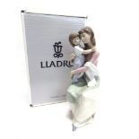 A LLADRO FIGURAL GROUP 'A MOTHER'S LOVE/ EN AL REGAZO DE MAMA' no. 6634, modelled as a mother