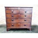 AN EARLY 19TH CENTURY MAHOGANY CHEST with two 'secret' frieze drawers above two short and three long