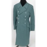 POLIZEI - AN EM / NCO SERVICE GREATCOAT of green heavy wool rayon construction, double-breasted