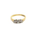 A THREE STONE DIAMOND 18 CARAT GOLD RING the brilliant cuts totalling approximately 0.3 carats,