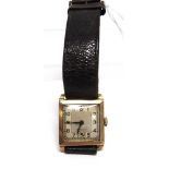 VERTEX, A GENTLEMANS 18 CARAT GOLD MECHANICAL WRIST WATCH ON A LATER STRAP the square silver dial