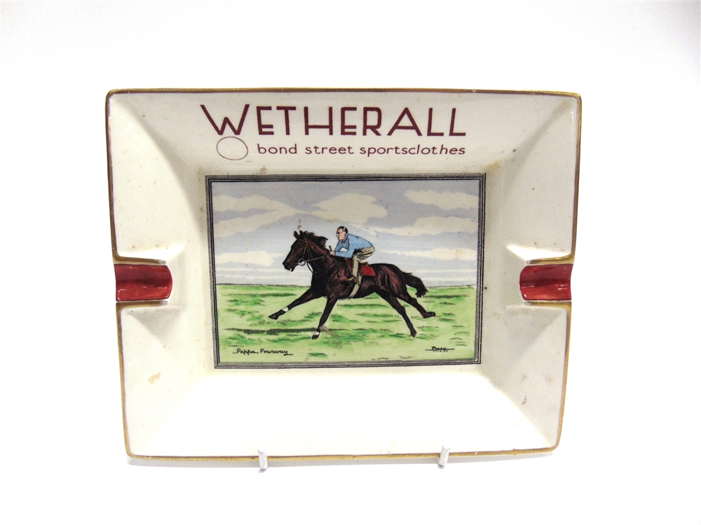 ADVERTISING - A WETHERALL SPORTSCLOTHES POTTERY ASHTRAY the well with an over-painted transfer print