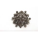 A LATE VICTORIAN DIAMOND SNOWFLAKE PENDANT BROOCH the central silver collet set diamond of