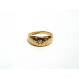 AN 18 CARAT GOLD RING Chester 1915, star set with a small old single cut diamond, finger size P1/