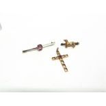 A STONE SET BAR BROOCH stamped '15ct', 4.5g gross; a stone set cross pendant of open design, 3g