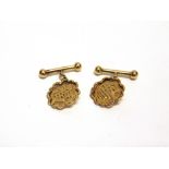 A PAIR OF CHINESE CUFFLINKS stamped '20' and 'W.H', possibly Wang Hing, the circular shaped panels