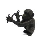 AN AUSTRIAN COLD PAINTED BRONZE FIGURE modelled as a monkey seated in comical pose, approx 7cm high