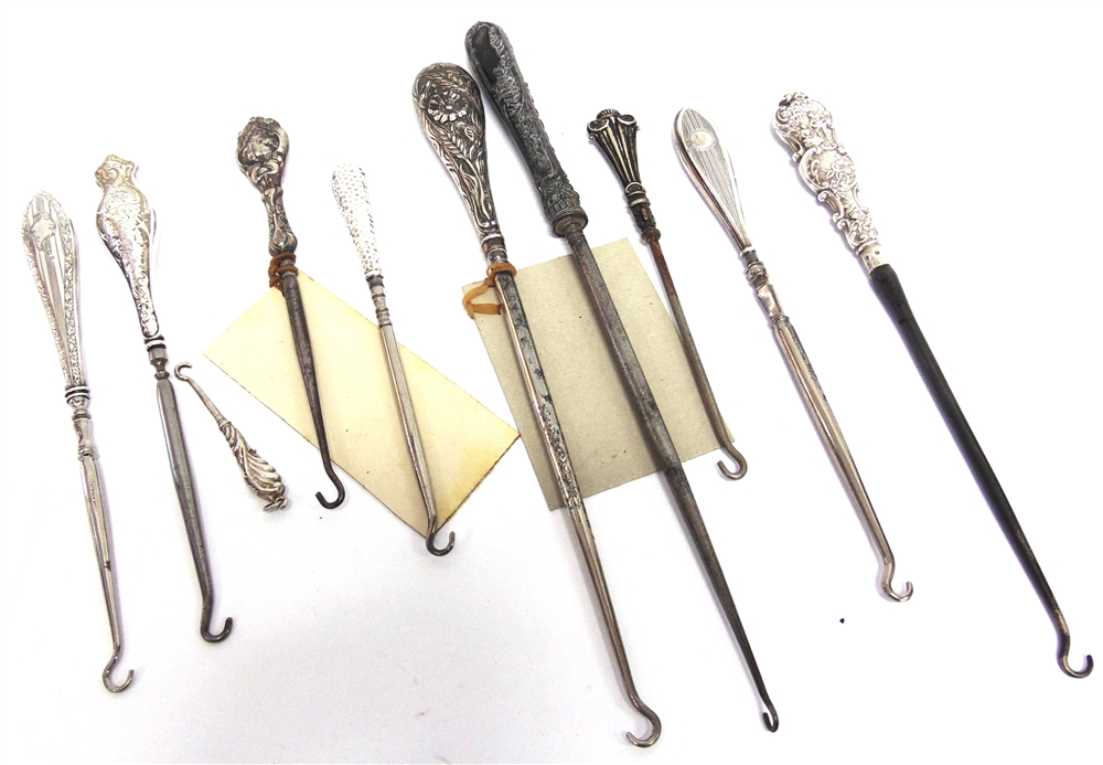 A COLLECTION OF TEN SILVER AND SILVER COLOURED BUTTON HOOKS