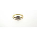 A SINGLE STONE RING with a hexagonal head, indistinctly marked, 2.6g gross