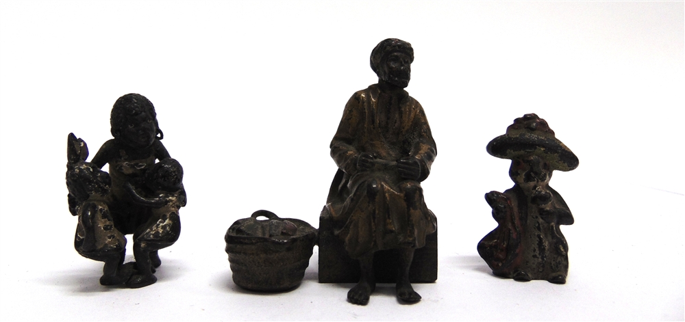 THREE AUSTRIAN COLD PAINTED BRONZE FIGURES: an Arabian street vendor seated beside a basket of his