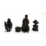 THREE AUSTRIAN COLD PAINTED BRONZE FIGURES: an Arabian street vendor seated beside a basket of his