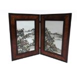 A PAIR OF CHINESE PORCELAIN PLAQUES enamelled with landscape scenes, held in a wooden frame, each