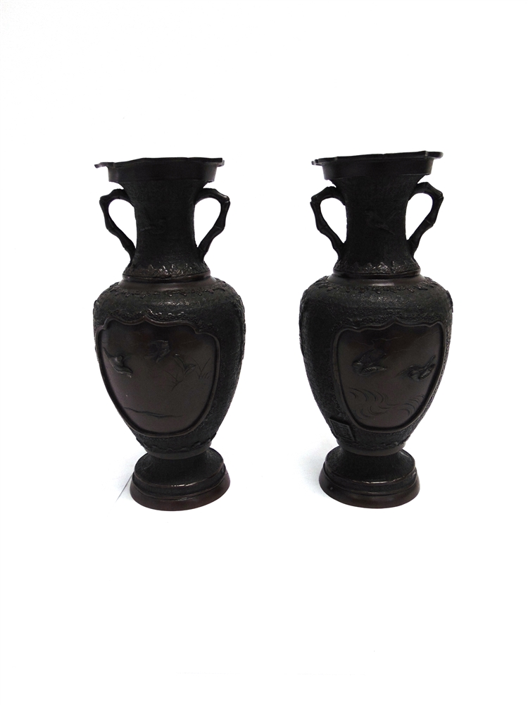 A PAIR OF JAPANESE BRONZE VASES the reserves with relief decoration of pairs of flying birds, six - Image 2 of 3