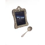 A LATE VICTORIAN SILVER PICTURE FRAME and plated sifting spoon